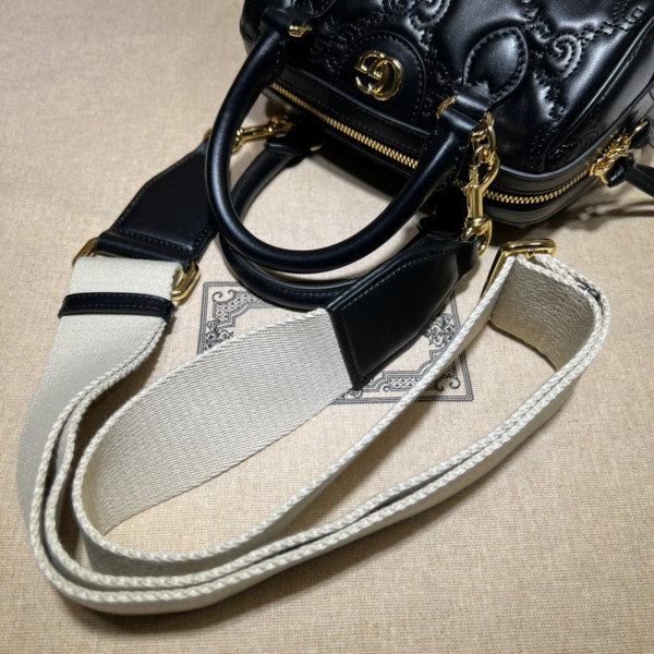 G*u*i gg matelassé leather top handle bag